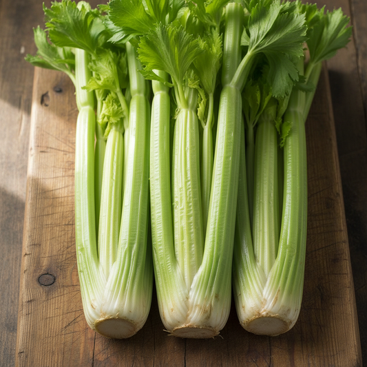 Tall crisp bright green celery stalks with leafy tops on rustic wooden surface