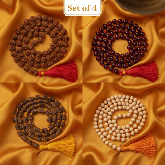 Combo of 4 jap malas — Rudraksha, Red Sphatik, Neem and Sandalwood arranged together on saffron silk cloth